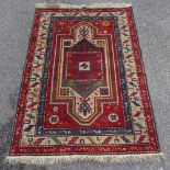 A Persian Tribal design red ground rug, 5'8" x 4'1"