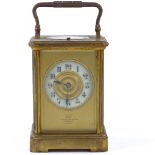 A French 8-day brass-cased carriage clock, enamel dial signed Dent of London, repeat movement