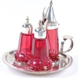 A modern silver and cranberry glass cruet set, on silver fitted tray, maker's marks JW, hallmarks