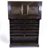 18th century French cherry wood display shelves, with decorated copper panelled cupboards above,