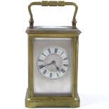 A French 8-day brass-cased carriage clock, enamel dial, 8-day movement striking on a gong, case