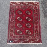 A handmade Persian red ground wool rug, 4'1" x 3'