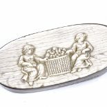A 19th century unmarked white metal snuffbox, with inset relief carved ivory panel to the lid,