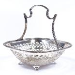 A George V silver cake basket, with gadrooned rim and pierced border, indistinct maker's marks,