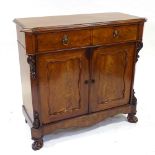 A 19th century mahogany chiffoniere, with 2 frieze drawers, panelled cupboards under, and carved