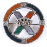 A Scottish unmarked silver hardstone circular brooch, with crown X design, set with citrines,