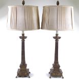 A pair of French Empire style brass table lamps and shades, height to top of shades 82cm