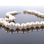 A single-strand choker pearl necklace, with unmarked gold diamond set ribbon clasp, pearl diameter