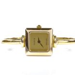 GUCCI - a lady's gold plated 1900L bangle quartz wristwatch, square champagne dial, case no.