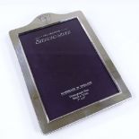 A modern sterling silver-fronted photo frame, by Carr's of Sheffield, hallmarks Sheffield 2000,