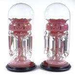 A pair of Victorian pink glass table lustres, with painted gilded decoration, original heavy cut-