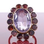 A 9ct gold amethyst and flat-top garnet cluster panel ring, with outer closed back settings, setting