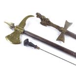 A Victorian ornamental brass-headed axe, with steel handle and concealed dagger, length 56cm,