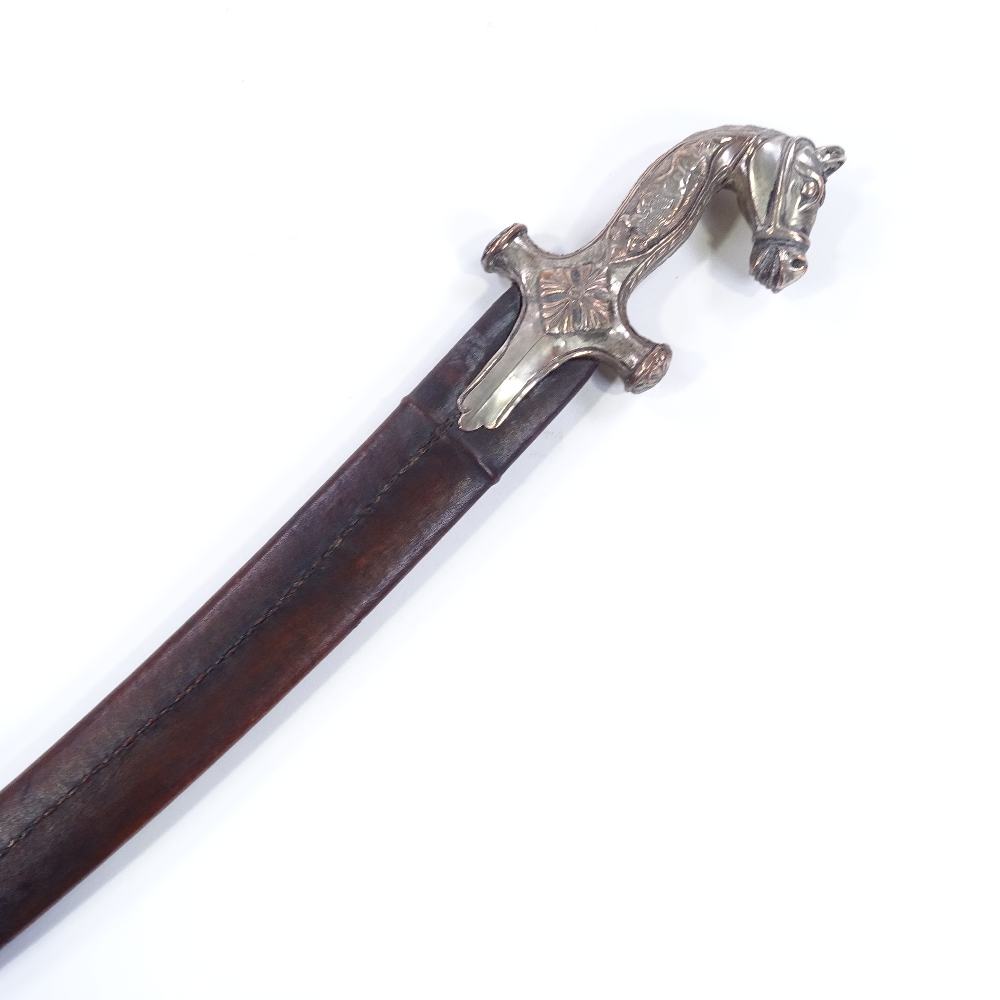 An Indian curved sword, with horsehead design hilt and lion and buffalo design grips, plain curved - Image 3 of 3