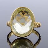 An unmarked silver-gilt faceted quartz panel ring, with engraved zig-zag shank, panel height 17.2mm,