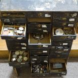 HOROLOGY INTEREST - a watchmaker's chest of drawers and contents, including watch parts,