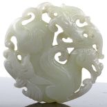 A Chinese relief carved and pierced jade pendant, 5cm across