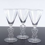 Rene Lalique set of 3 glasses with funnel-shaped bowls and moulded Classical figure design stems,