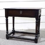 A George III joined oak side table, with turned supports, frieze drawer and square stretchers, 28.5"
