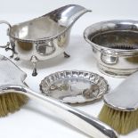 A silver sauce boat, silver pin tray, 2 silver-backed brushes, and a plated rose bowl, 4.9oz