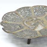 A Chinese silver pedestal dish, with relief embossed dragon decoration, pierced floral panels and