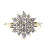 An 18ct gold diamond cluster snowflake ring, total diamond content approx 0.5ct, setting height 11.