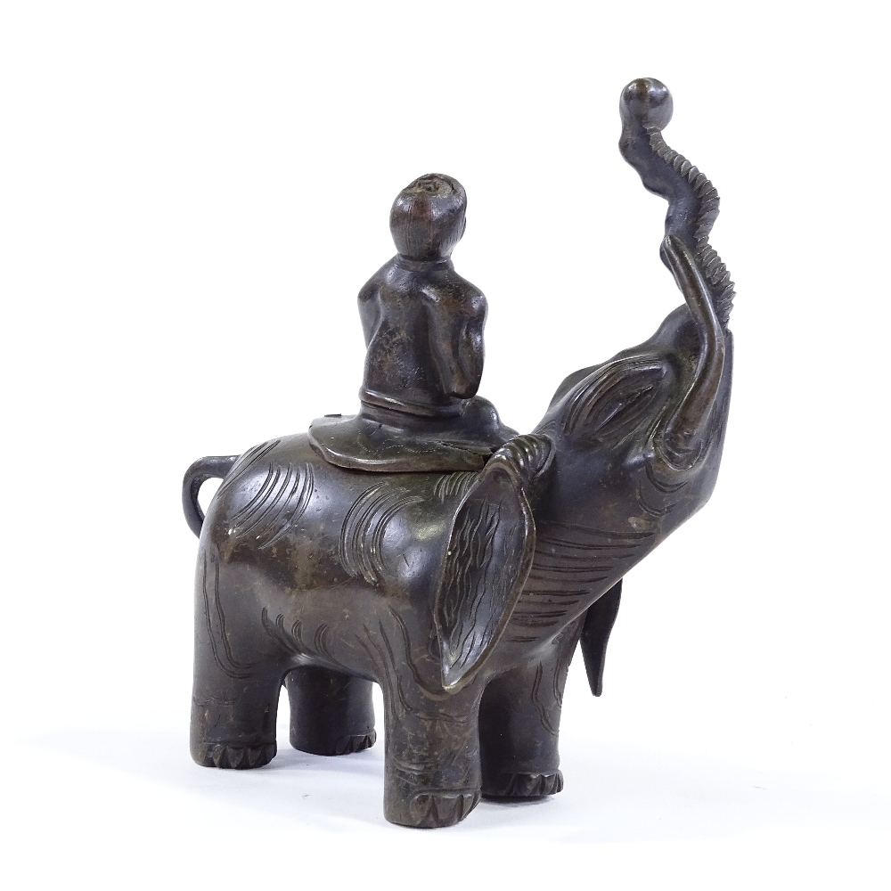 A Chinese patinated bronze incense burner, in the form of a figure seated on an elephant, height - Image 2 of 3