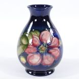 A Moorcroft Pottery Anemone pattern vase, height 18cm