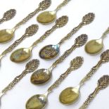 A set of 12 Danish silver-gilt coffee spoons, with cast floral handles, hallmarks Copenhagen 1939,
