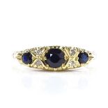 An 18ct gold sapphire and diamond half-hoop ring, with scroll engraved bridge, setting height 5.7mm,