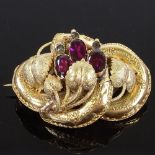A Victorian unmarked gold almandine garnet and paste floral knot brooch/pendant, brooch length 51.