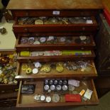 HOROLOGY INTEREST - a watchmaker's stepped table-top chest of drawers and contents, including