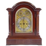 A Victorian mahogany-cased dome-top bracket clock, with ornate engraved brass and silvered dial, and