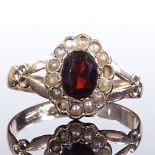 A 9ct gold garnet and split-pearl cluster ring, hallmarks Birmingham 1916, setting height 11.9mm,