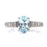 A 14ct white gold aquamarine dress ring, with diamond set shoulders, setting height 8mm, size M, 3.