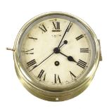 An early 20th century Smiths brass-cased ship's clock with 8-day movement, bezel diameter 19cm