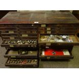 HOROLOGY INTEREST - a watchmaker's double-bank chest of drawers and contents, including parts,