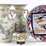A pair of Oriental porcelain vases, with rope design handles and painted flowers, height 27cm, a