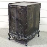 A 19th century Chinese hardwood side cupboard, with relief carved bamboo decorated doors, width 18",