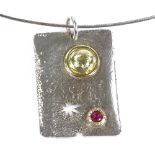 A handmade designer silver gold plate and ruby panel pendant necklace, of textured design with