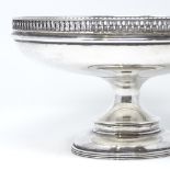 A George V circular silver pedestal tazza, with column rim and banded foot, by Walker & Hall,
