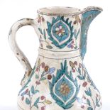 A Turkish pottery coffee pot with hand painted decoration, height 16cm