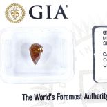 A GIA certified unmounted 1.01ct fancy brown orange pear brilliant-cut diamond, diamond measures 7.