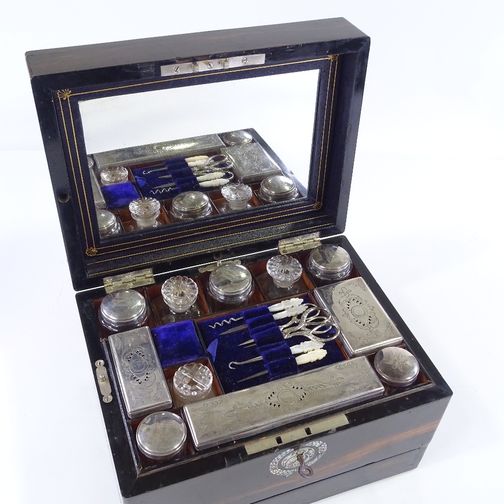 A Victorian coromandel travelling toilet box, the interior fitted with original cut-glass jars