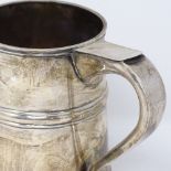 A George V silver pint mug, of tapered form, with banded body, by Harrods Ltd, hallmarks London
