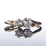 An 18ct gold 2-stone diamond crossover ring, total diamond content approx 0.45ct, setting height