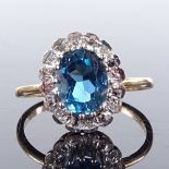 An unmarked gold blue topaz and diamond cluster ring, setting height 14.1mm, size N, 2.9g