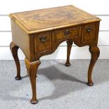 A walnut lowboy with 3 frieze drawers and carved cabriole legs, width 2'5"