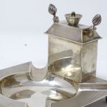 A silver smoker's companion, with central burner, removable lighter sticks and ashtray, by Padgett &