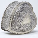 A Victorian silver heart-shaped trinket box, with relief embossed floral and foliate decoration,
